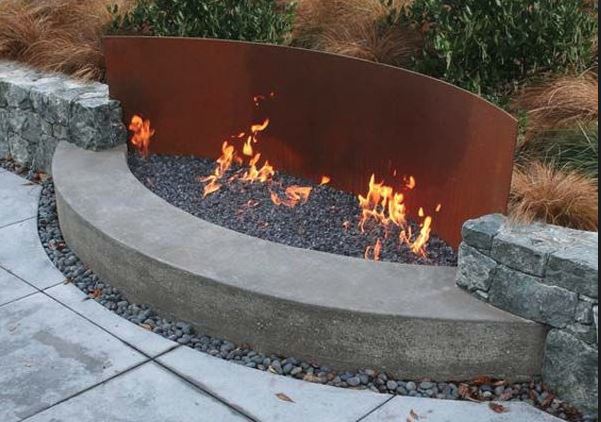 Curved cor-ten steel back fire pit