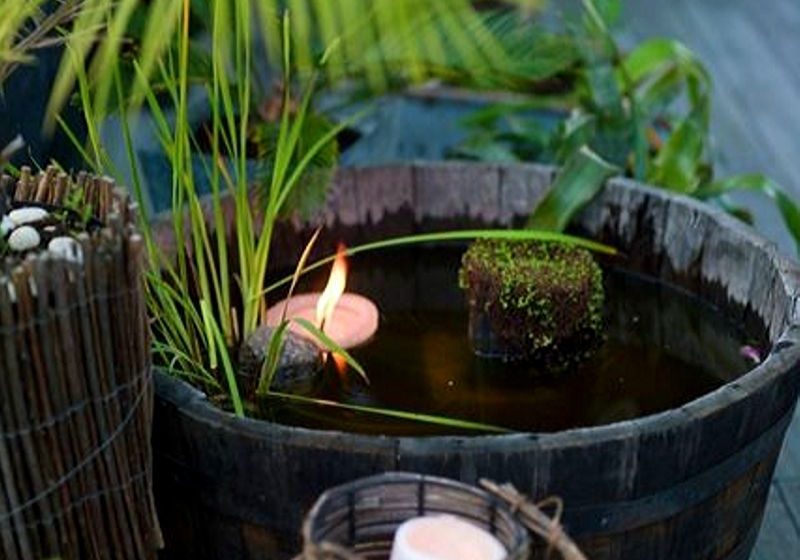 Half whiskey barrel water feature