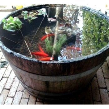 7 Fun Ways To Create A Water Feature From Half Whiskey Barrels