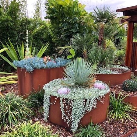 Round corten steel garden planters