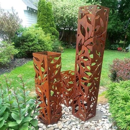 Corten steel garden pillars cut with a floral pattern