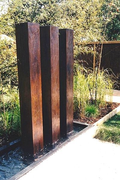 A trifecta of corten steel fountain pillars