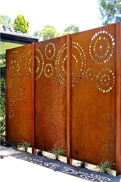 A rusty corten steel privacy fence